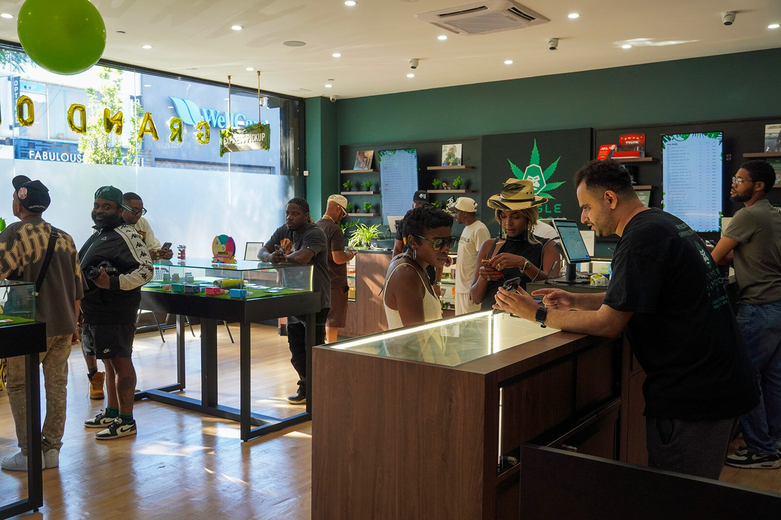 Customers shopping inside Jungle Kingdom Flower cannabis dispensary in Brooklyn